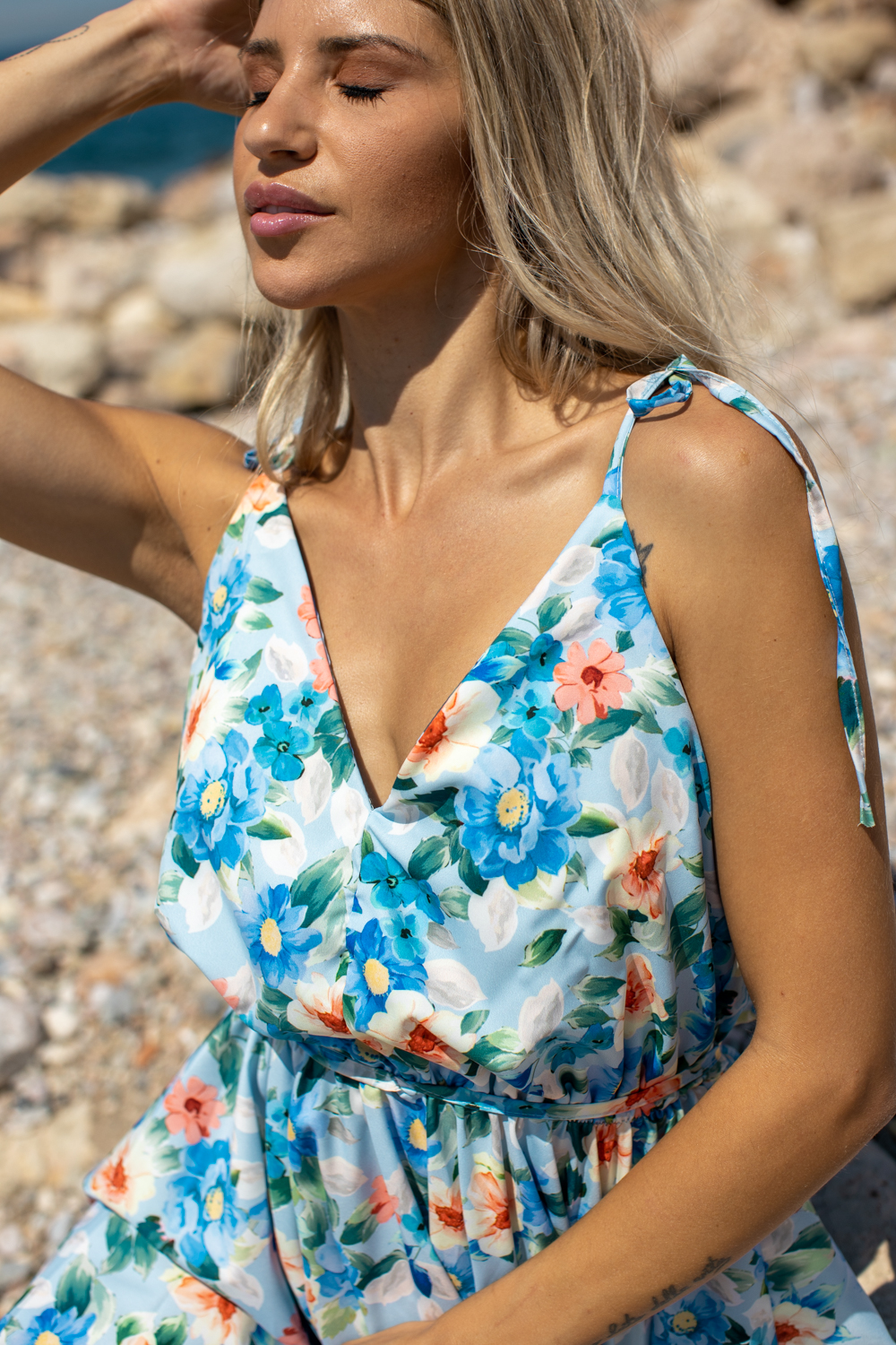 Blonde Woman Wears sleeveless Floral Summer Dress