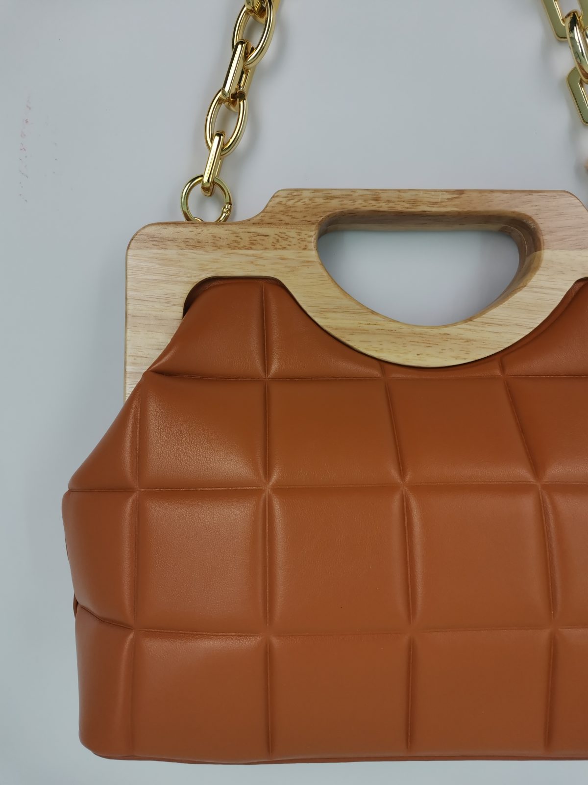 Brown bag with wooden handle and gold chain