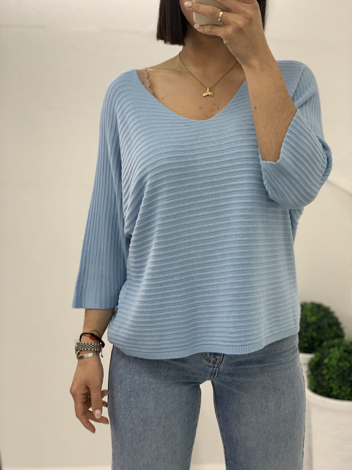 Thin cotton blouse with neckline in blue color