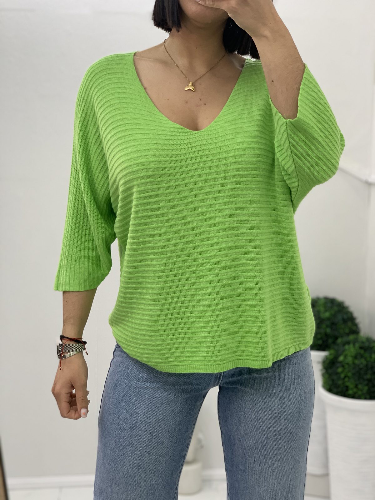 Thin cotton blouse with neckline in green color
