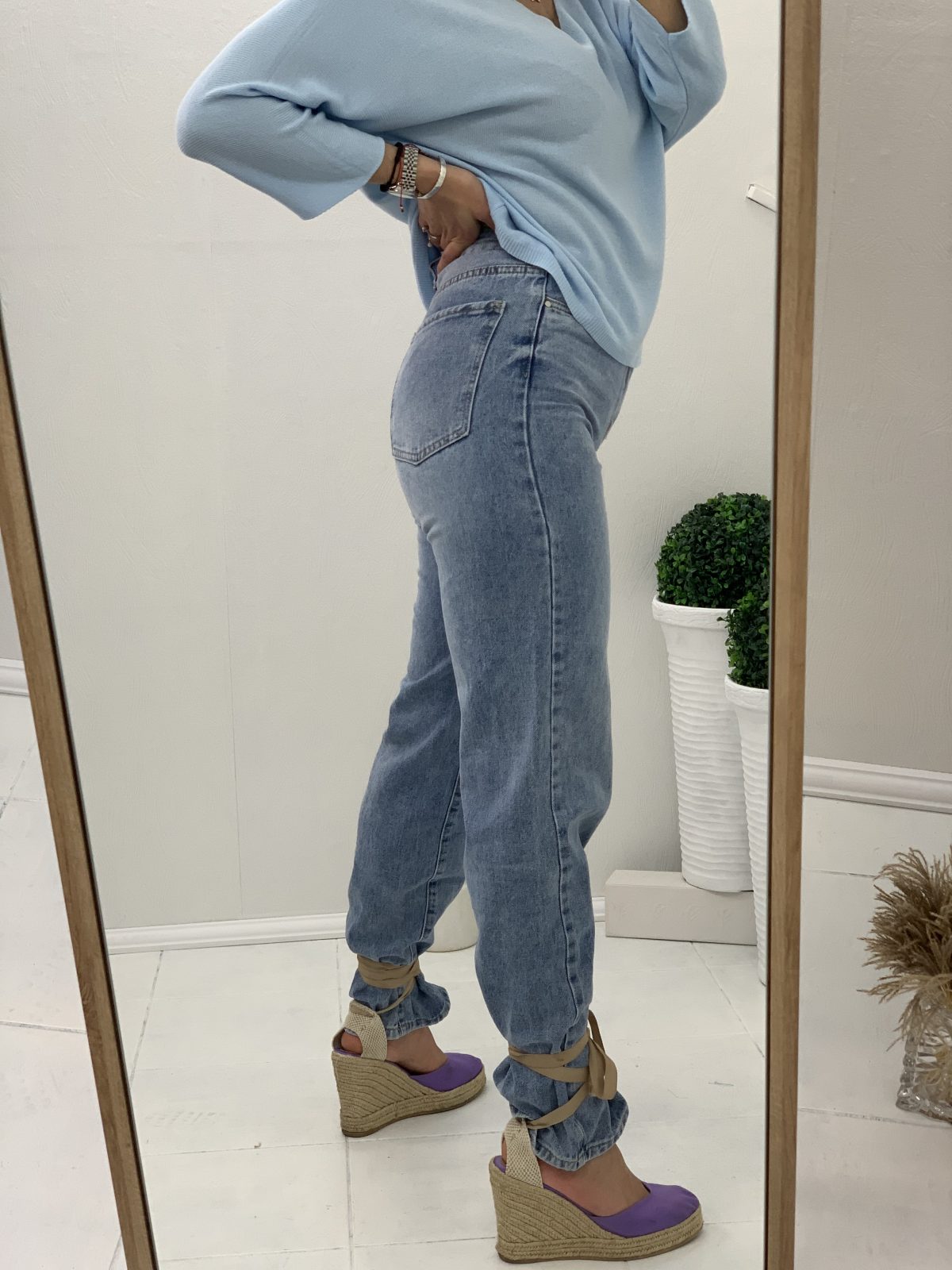 High-waisted light-colored jeans